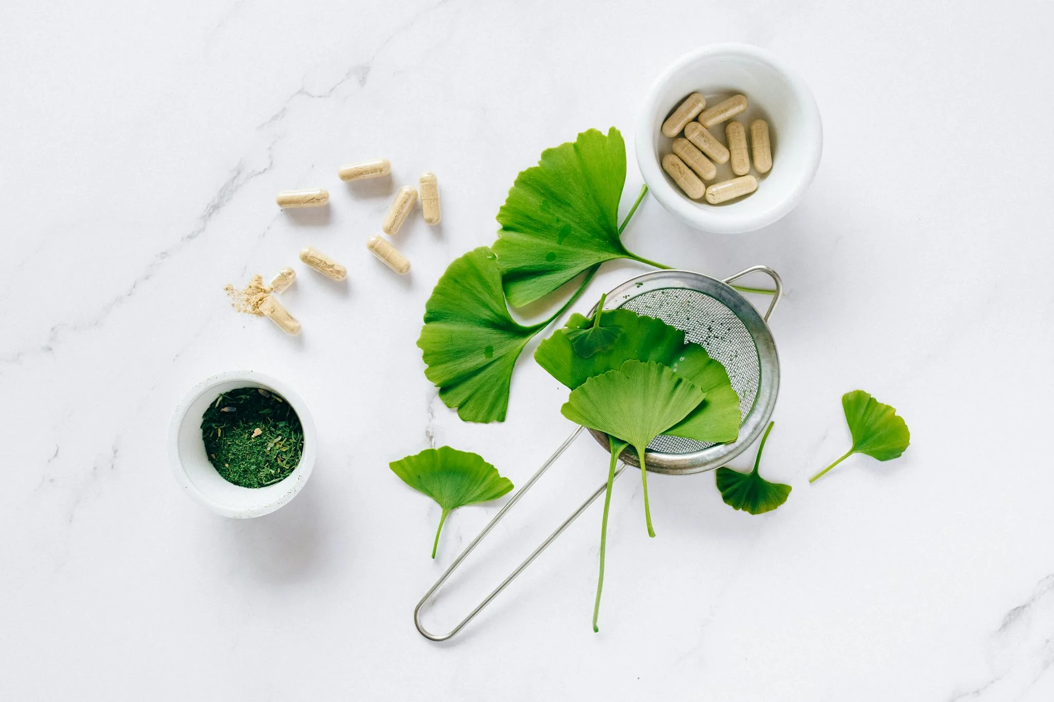 ginkgo leaves and a strainer